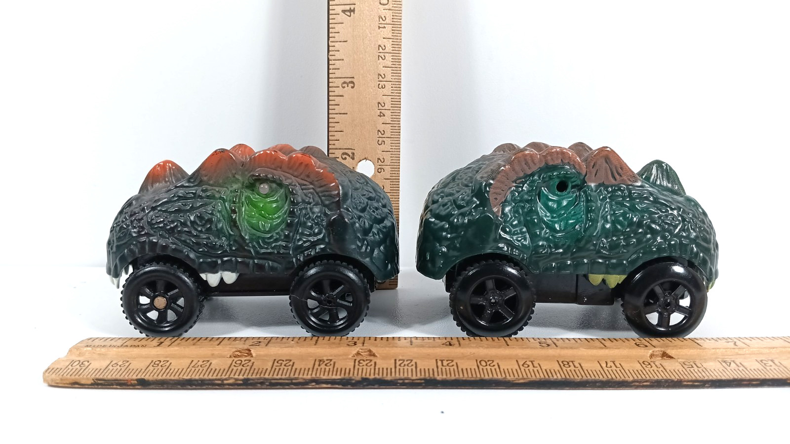 Dinosaur Head Monster Truck Toy Battery Powered Eyes Light Up 2 pack