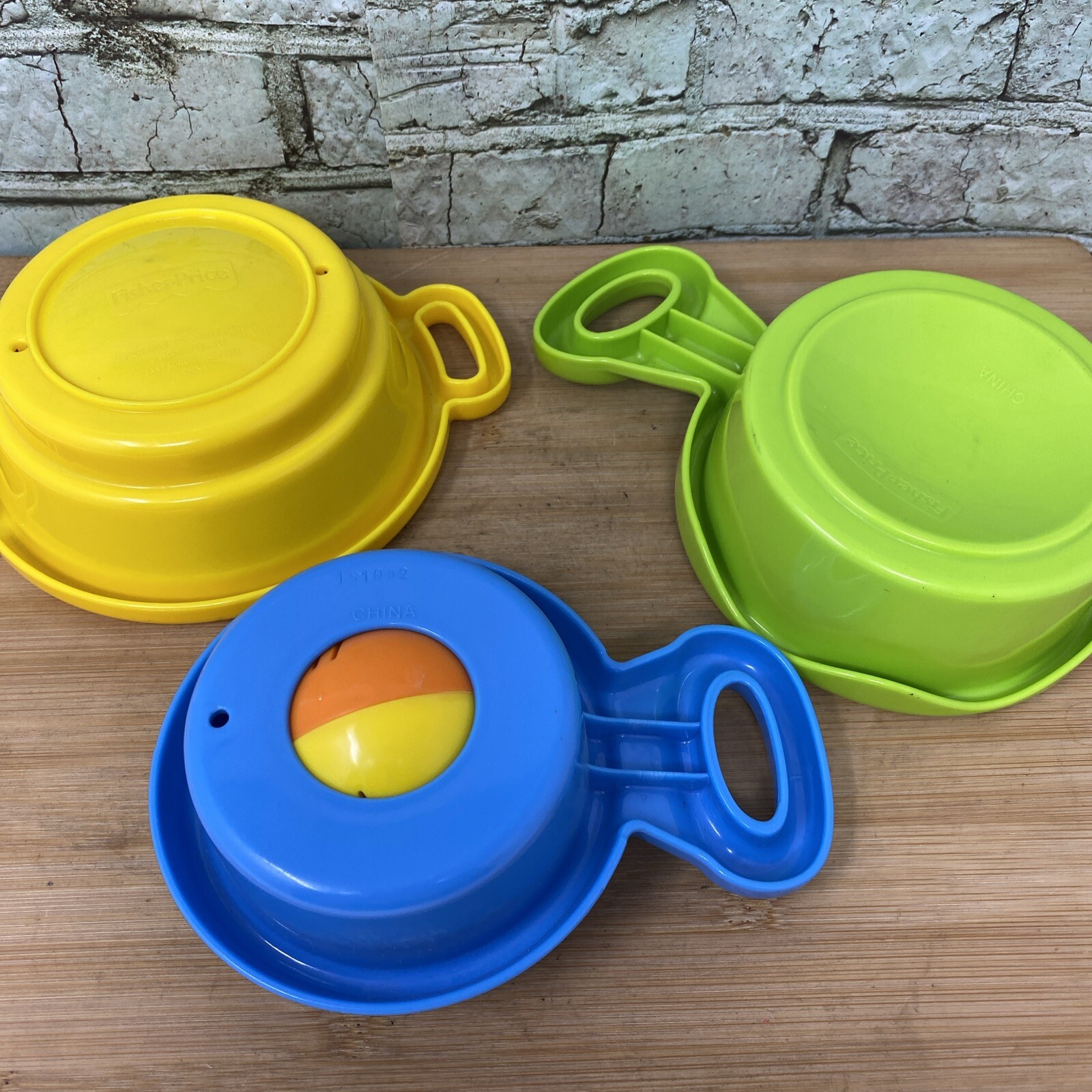Fisher Price Brilliant Basics Stack and Nest Pots and Pans Yellow Green Blue