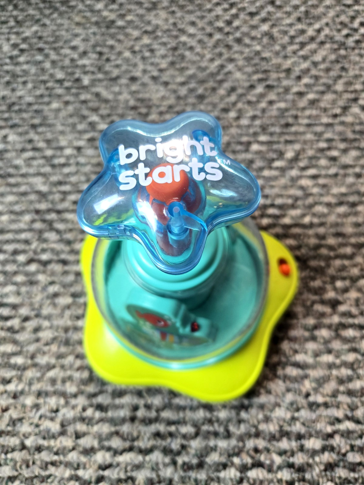 Bright Starts Press & Glow Spinning Top w/Lights & Music Toy Ages 6-36 mos.