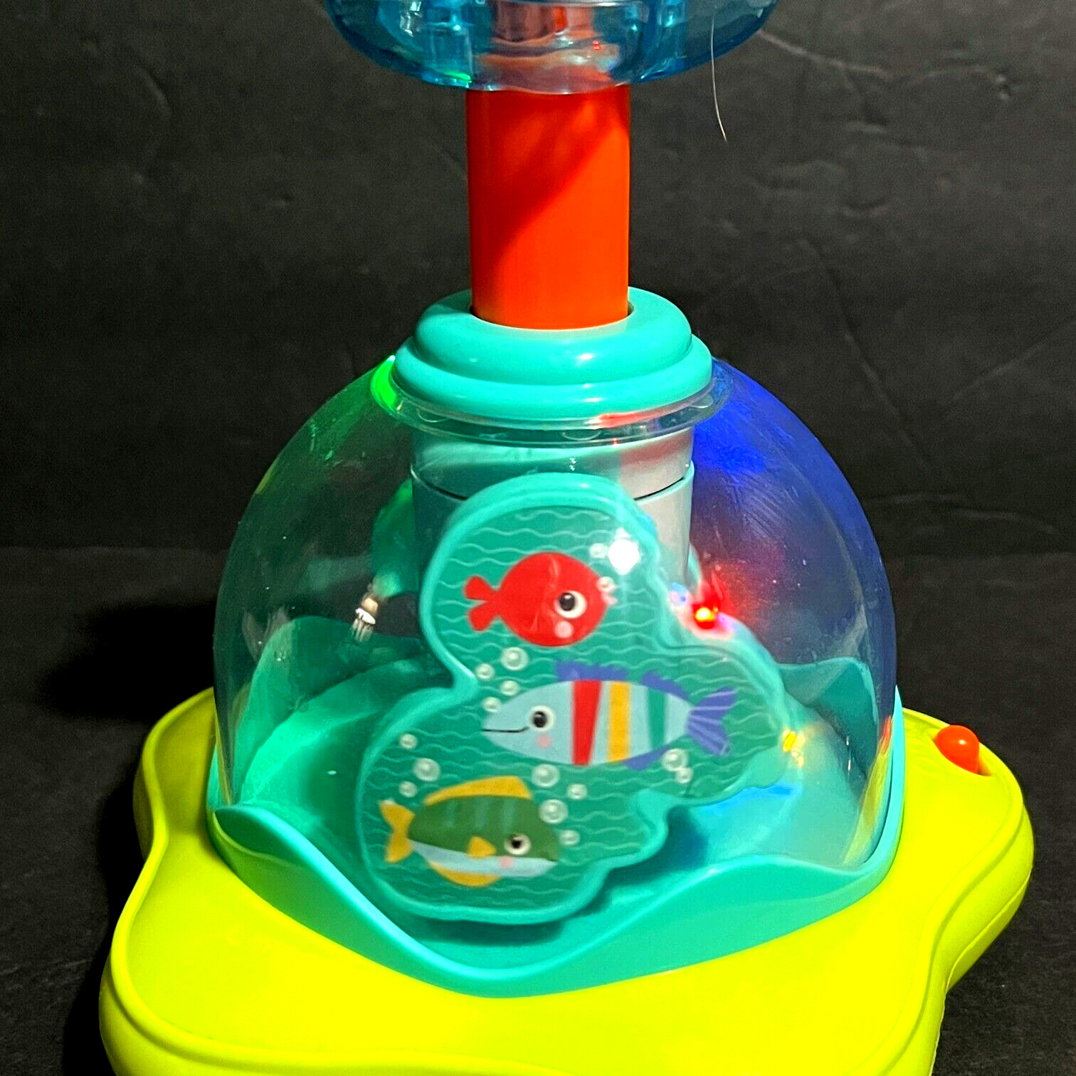 Bright Starts Press & Glow Spinning Top w/Lights & Music Ages 6-36 mos.