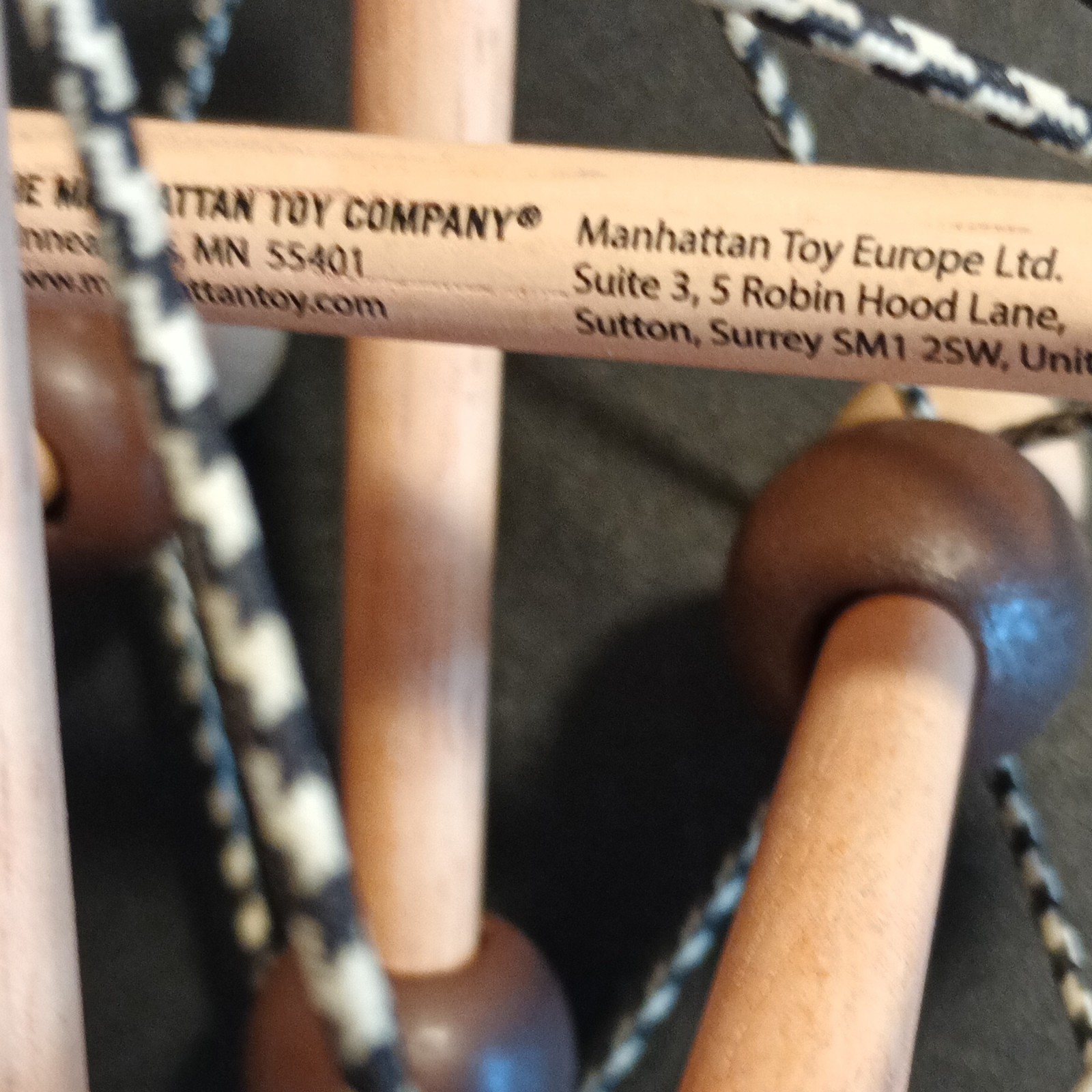 Manhattan Toy Company Skwish Wooden Baby Activity Grasping Toy Brown/Beige